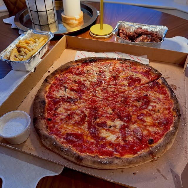 16 inch pizza in a box with fries and chicken