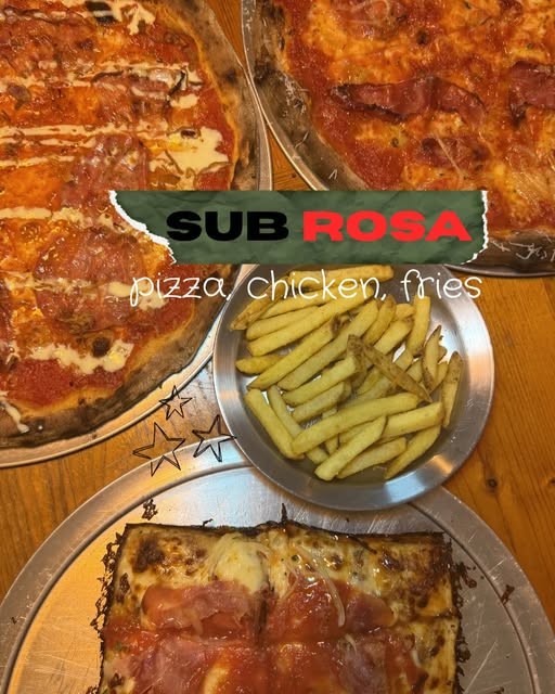 Pizza, chicken and fries spread at Sub Rosa